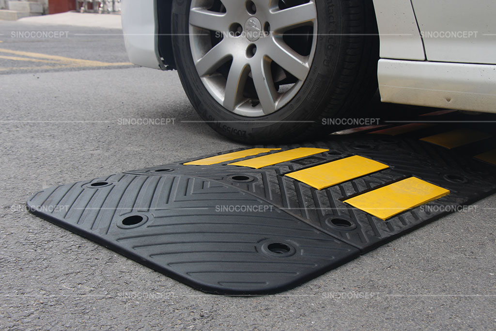 Black and yellow speed humps made of rubber used on roads for traffic management