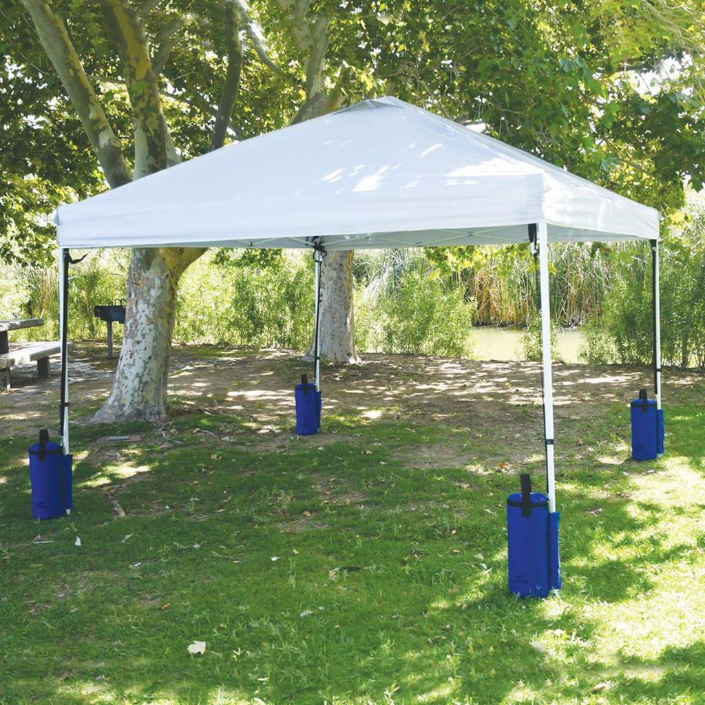 Blue sandbags are used to hold down tents outside