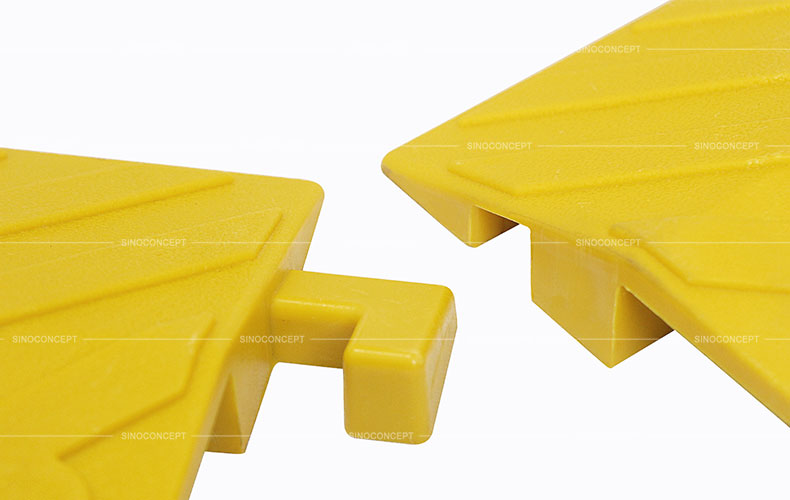 Small size yellow drop over cable ramps designed with a convenient and strong interlocking system to prevent disconnection