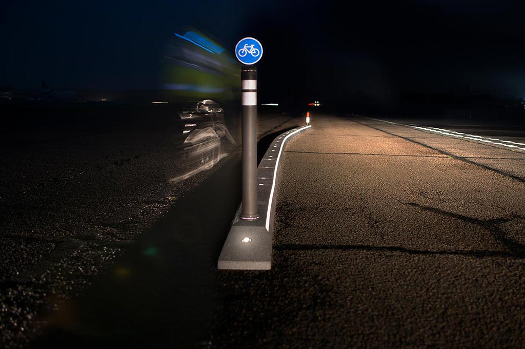 Long cycle lane separators with signposts inserted on the base used for the security of cyclists and motorists