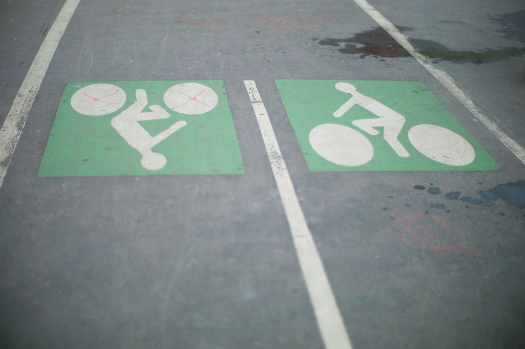 White and green road markings to indicate bicycle lanes to avoid road accidents