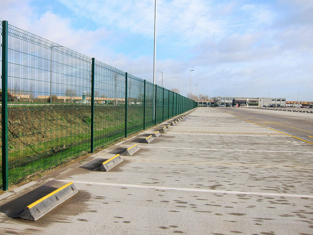 Heavy-duty wheel stops installed in an outside parking lot for better parking management