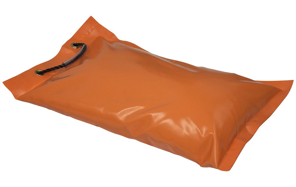 An orange traffic sandbag designed with a black string used for traffic safety purpose