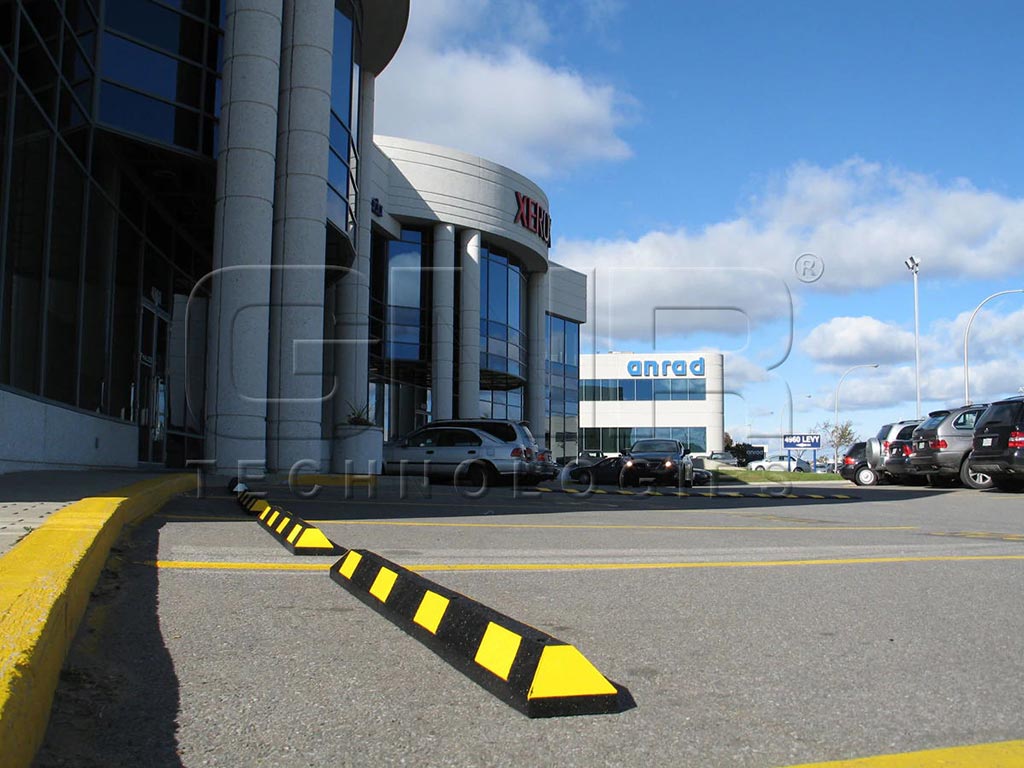 Park-It parking kerbs colourd in black and yellow used for car parking management
