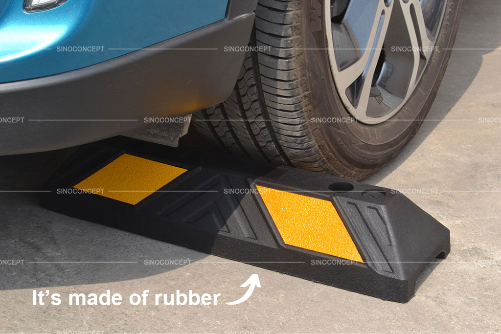 A parking block made of recycled rubber with yellow reflective films for better parking management