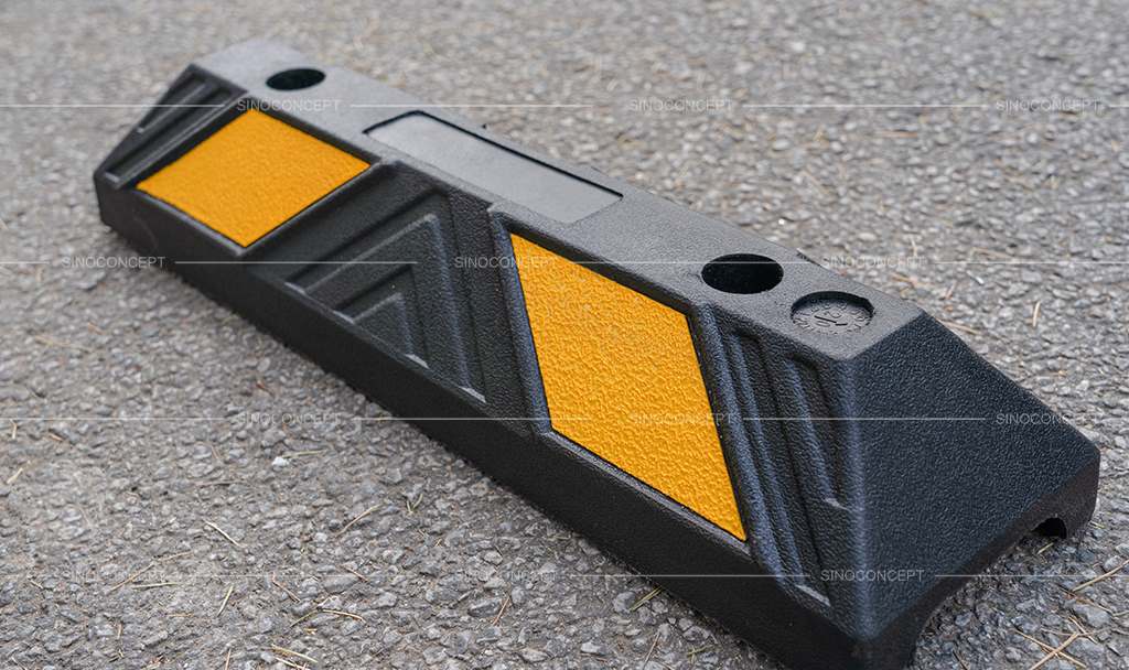 Rubber parking kerbs made of black recycled rubber with white or yellow glass bead reflective tapes for car park management.