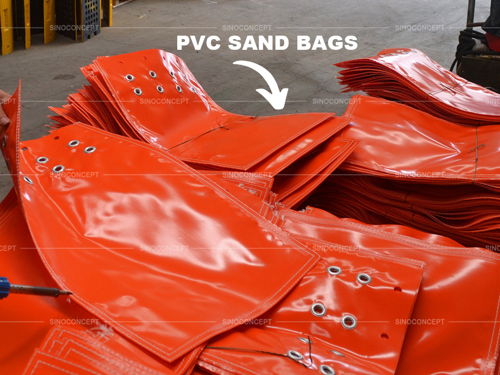 Orange PVC sandbags stored in Sino Concept factory, waiting to be delivered to clients