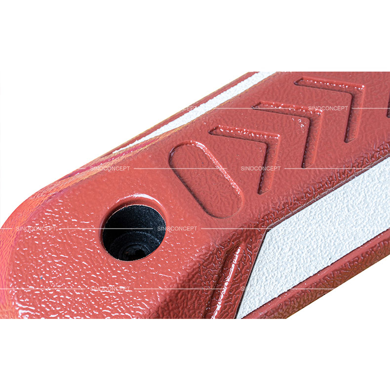 Red cycle lane separator also called cycle lane divider made of plastic-rubber composite showing arrows design on the surface.