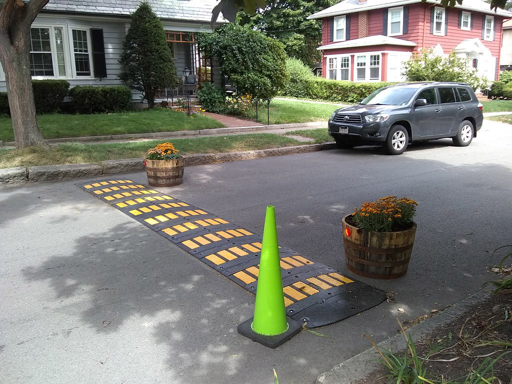 Rubber speed bumps connected together and installed across the road to reducing vehicle speed there