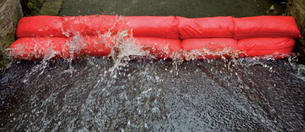 Red sandbags manufactured by Screwfix to prevent floods