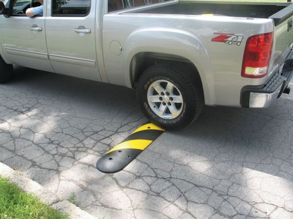 A long speed breaker installed on the road for traffic safety purpose