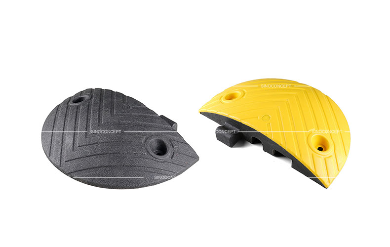A black and a yellow end parts of a 7cm height Plastic-Rubber composite speed bump.