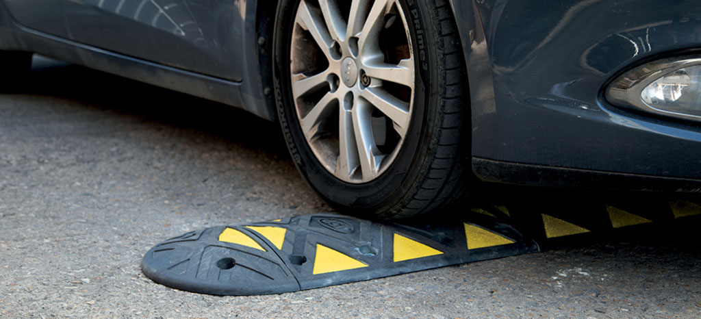 Black speed ramp with yellow triangle reflective films made by JSP used to slow vehicle speed