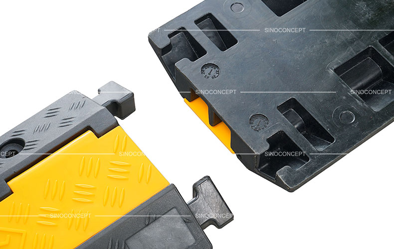 A two-channel outdoor cable protector made of vulcanized rubber and plastic lid designed with a strong and convenient interlocking system.