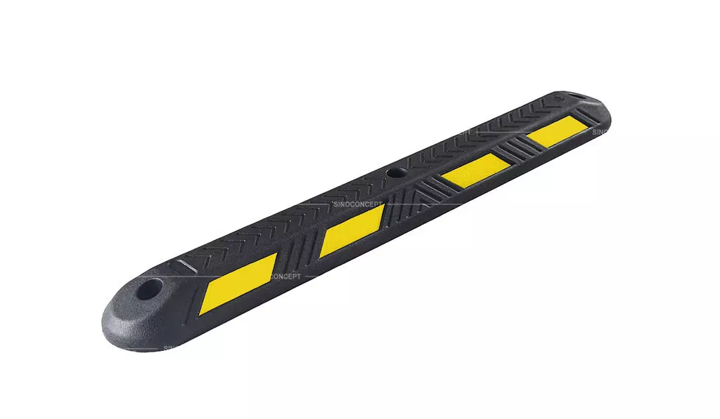 A black rubber lane divider with yellow reflector films