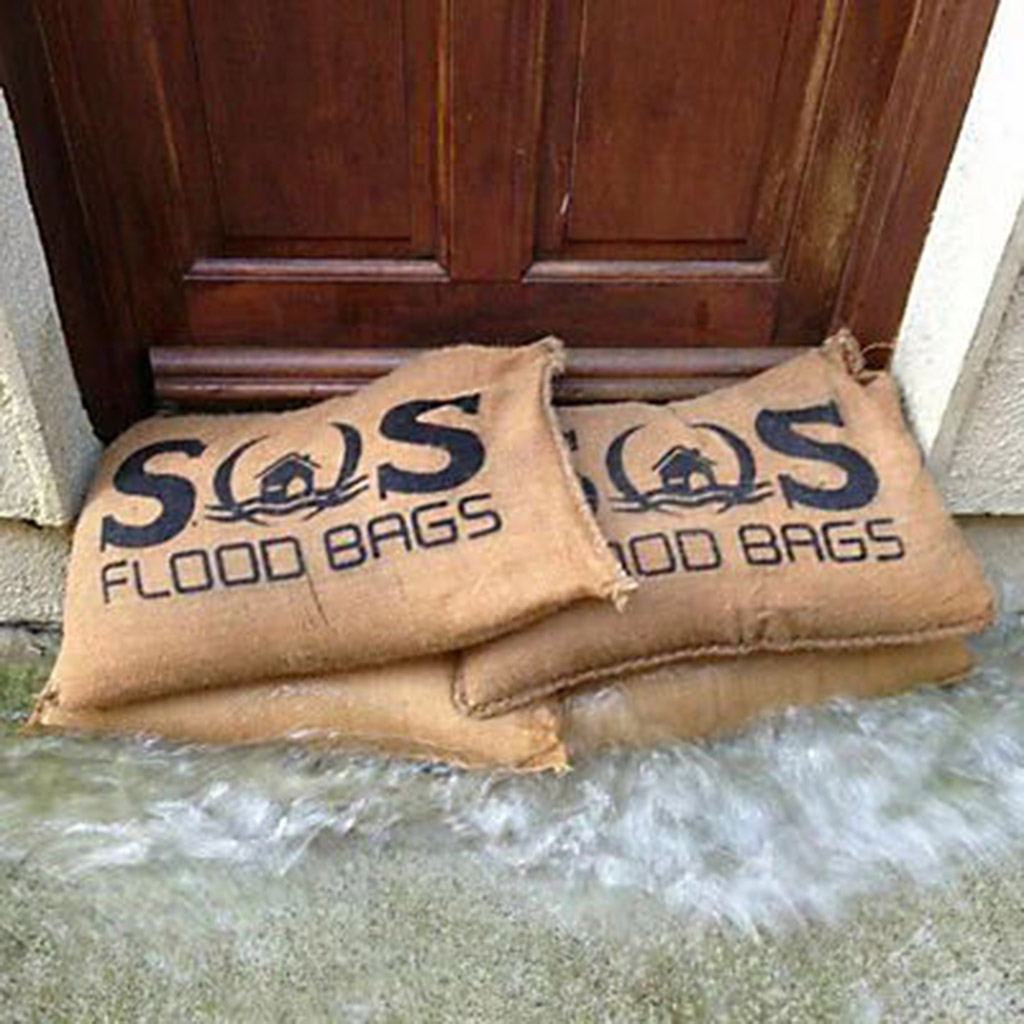 Some sandbags are put in front of the door to prevent flooding out of the house