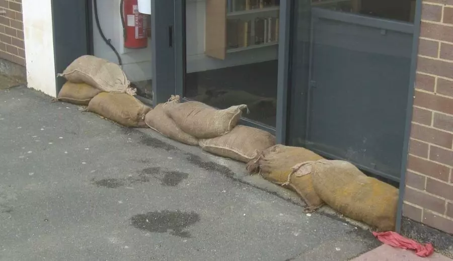 Hessian sandbags are put together by the door.