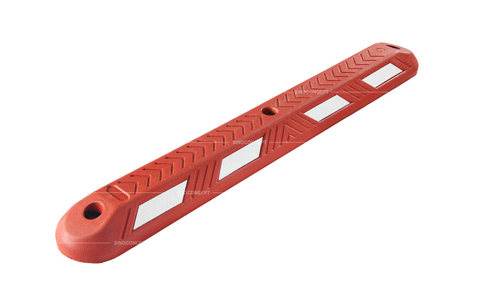 Red lane separator made of vulcanized rubber, pasted with white reflective films and designed with arrow stripes
