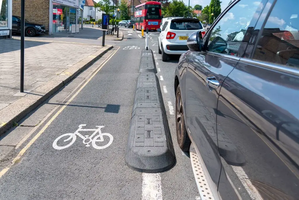 Rubber lane separator curbs on the road to separate different lanes.