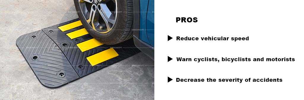 A black rubber road hump made of recycled rubber with yellow reflective tapes for traffic safety management.