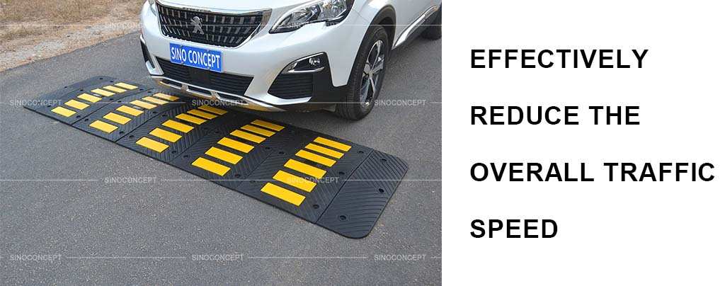 A black rubber speed hump made of recycled rubber with yellow reflective tapes for traffic management.
