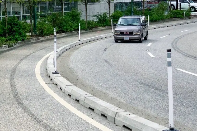 Concrete lane separator curbs on the road to separate different lanes.