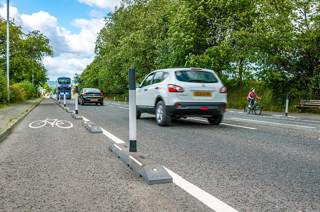 Black Rosehill cycle lane defenders with black and white posts fixed to the base for traffic safety