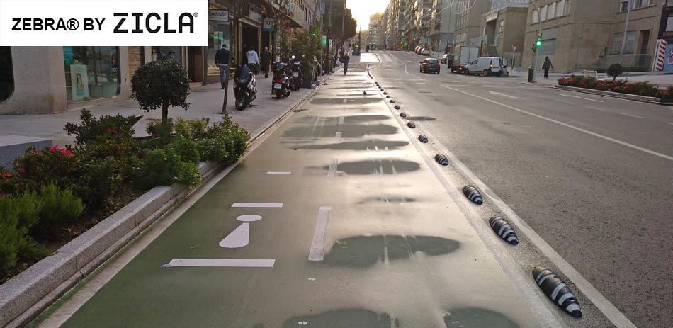 Zebra traffic lane separators installed on the road to separate cyclists and motor vehicles for traffic management