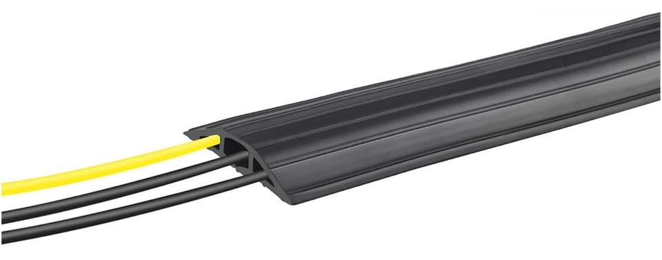 A 3-channel black floor cable cover to hide and protect cables.