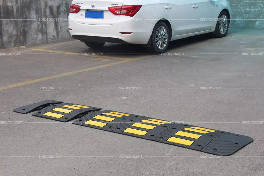 Rubber speed hump with yellow glass bead reflective tapes for traffic management.