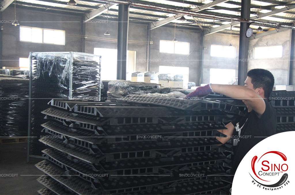 A worker is packing cable protectors inside the Sino Concept factory.