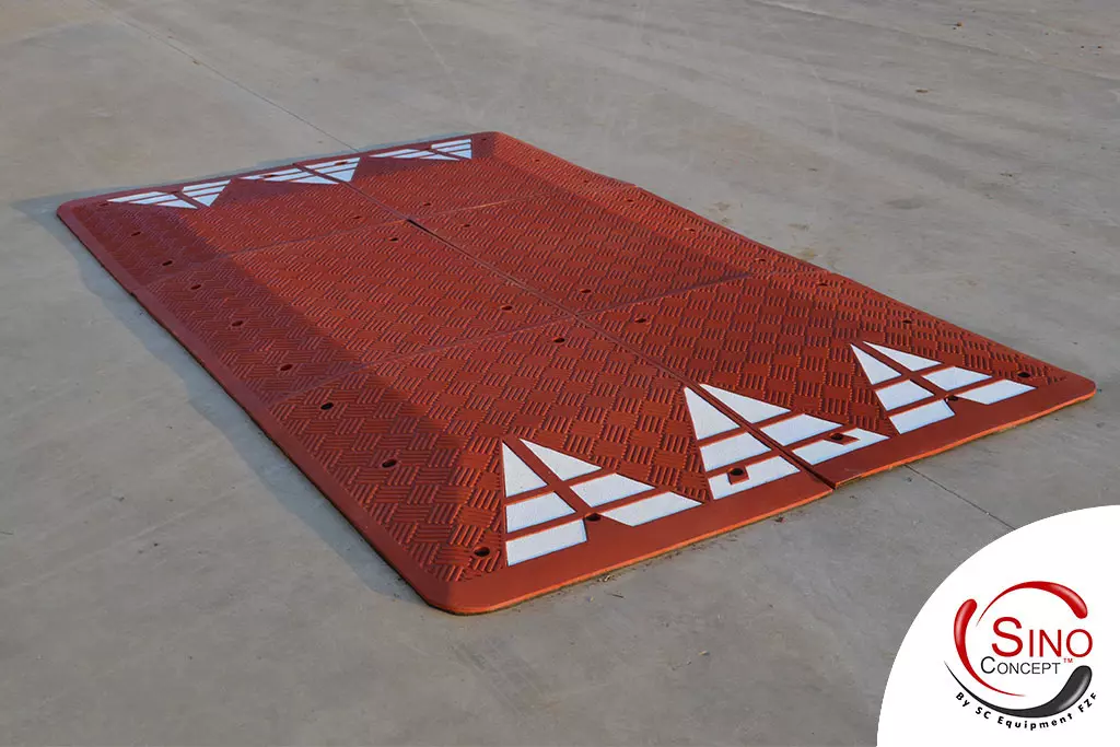 A Europe style red rubber speed cushion manufactured by Sino Concept for traffic safety management.