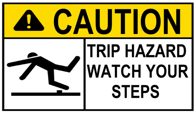 A traffic sign shows to caution trip hazard, watch your steps.