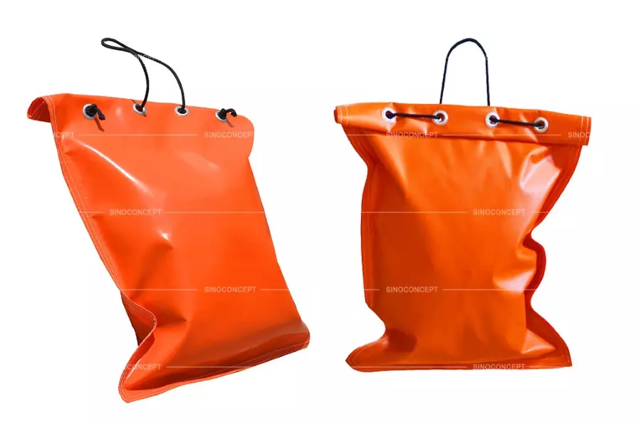 Two sturdy orange PVC sandbags made by Sino Concept.