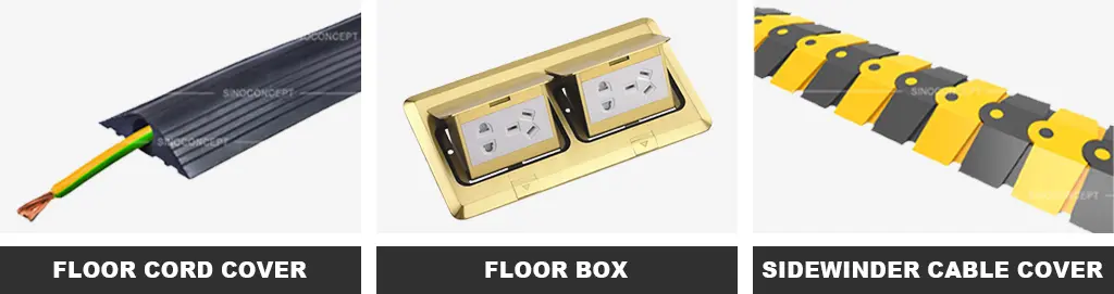 A black floor cord cover, a gold floor box, and a black and yellow sidewinder cable protector as cable management devices.