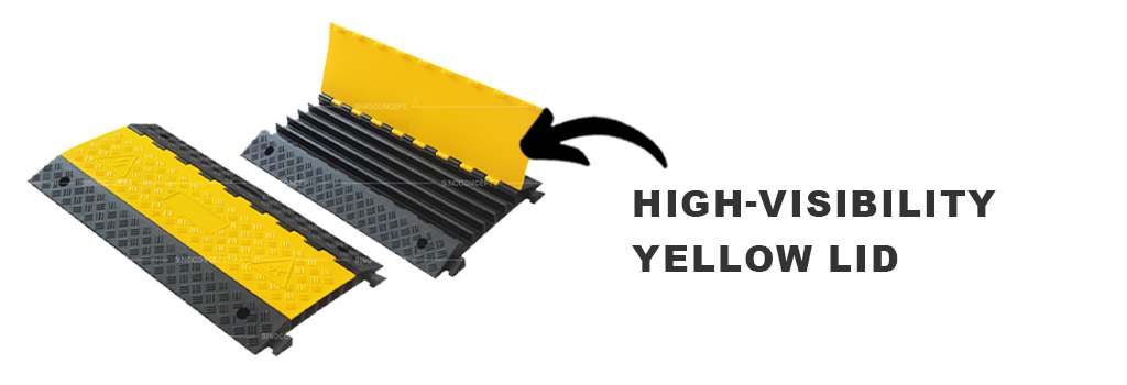 Black rubber cable ramps with high-visibility yellow lids for cable management.