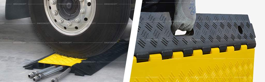 Heavy-duty cable guard made of black rubber with yellow lids and convenient carrying handles.