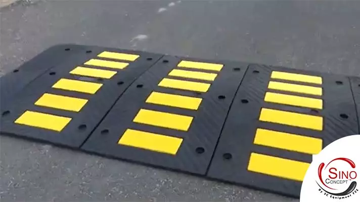 Rubber speed hump with yellow glass bead reflective tapes for traffic management, manufactured by Sino Concept.