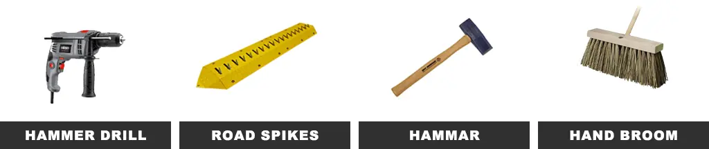 Some tools: a hammer drill, road spikes, a hammer, and a hand broom.