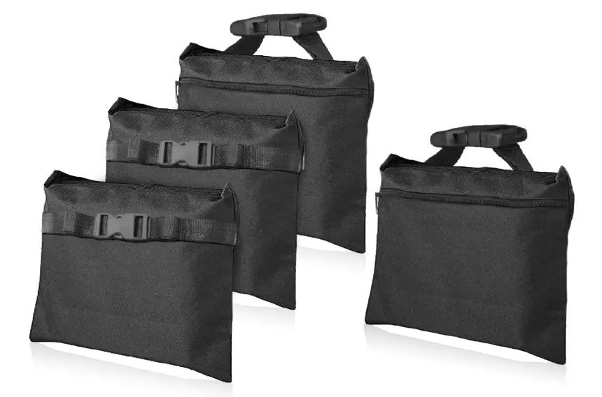 Four black sandbags made of canvas with zippers.