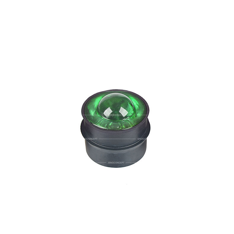Small size yellow reflective road stud also called road reflector made of glass and steel used as a traffic safety equipment