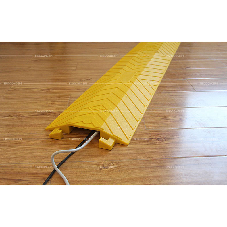 Large yellow drop over cable ramp made of polyurethane with one channel to protect cables, designed with anti-slip surface