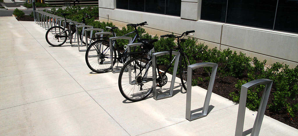 Bike racks lined up in a row for bike storage.