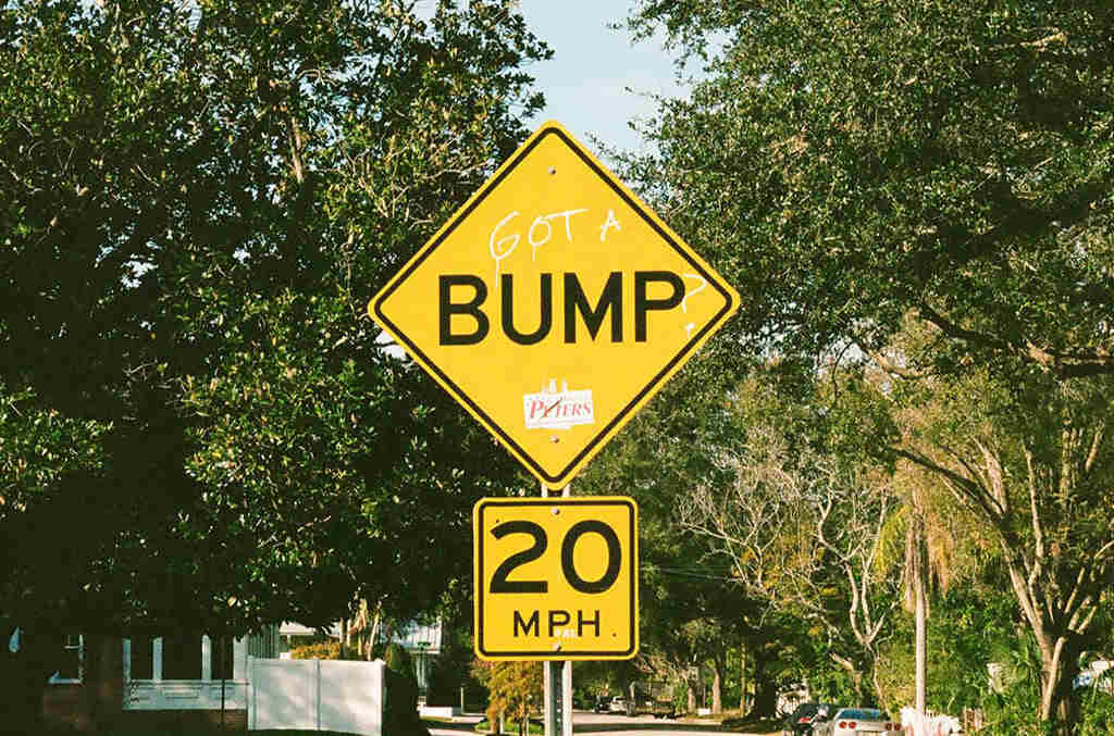 A yellow traffic sign with the word 'pump' on top and '20mph' underneath.