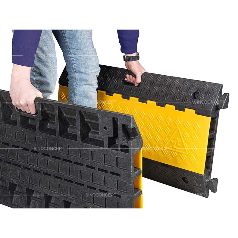 3-channel external cable protector with integrated handles for easy transport.