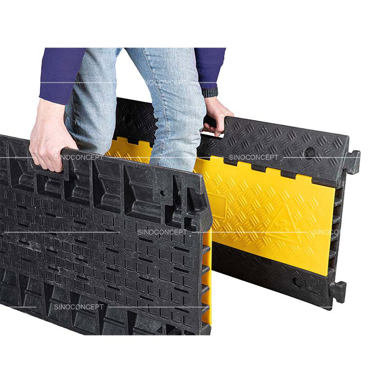 Outdoor 5-channel cable ramp with integrated handles for easy transport.
