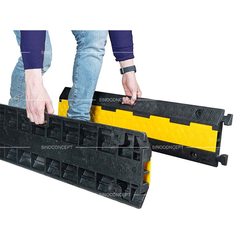 2-channel cable protector ramp with integrated handles for easy transport.