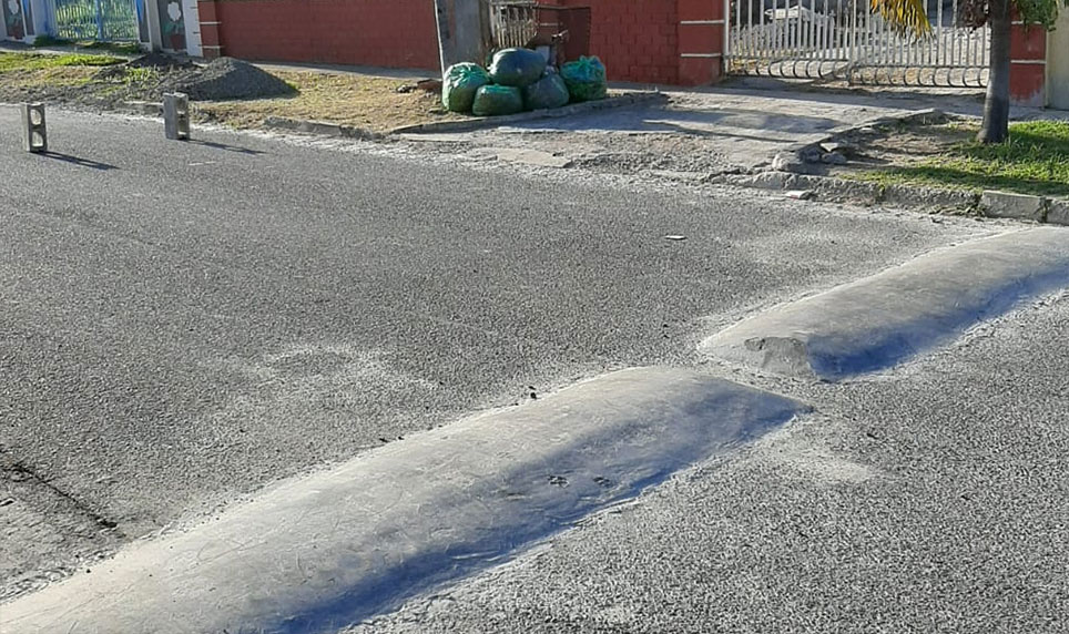 Concrete road bumps to reduce speed.