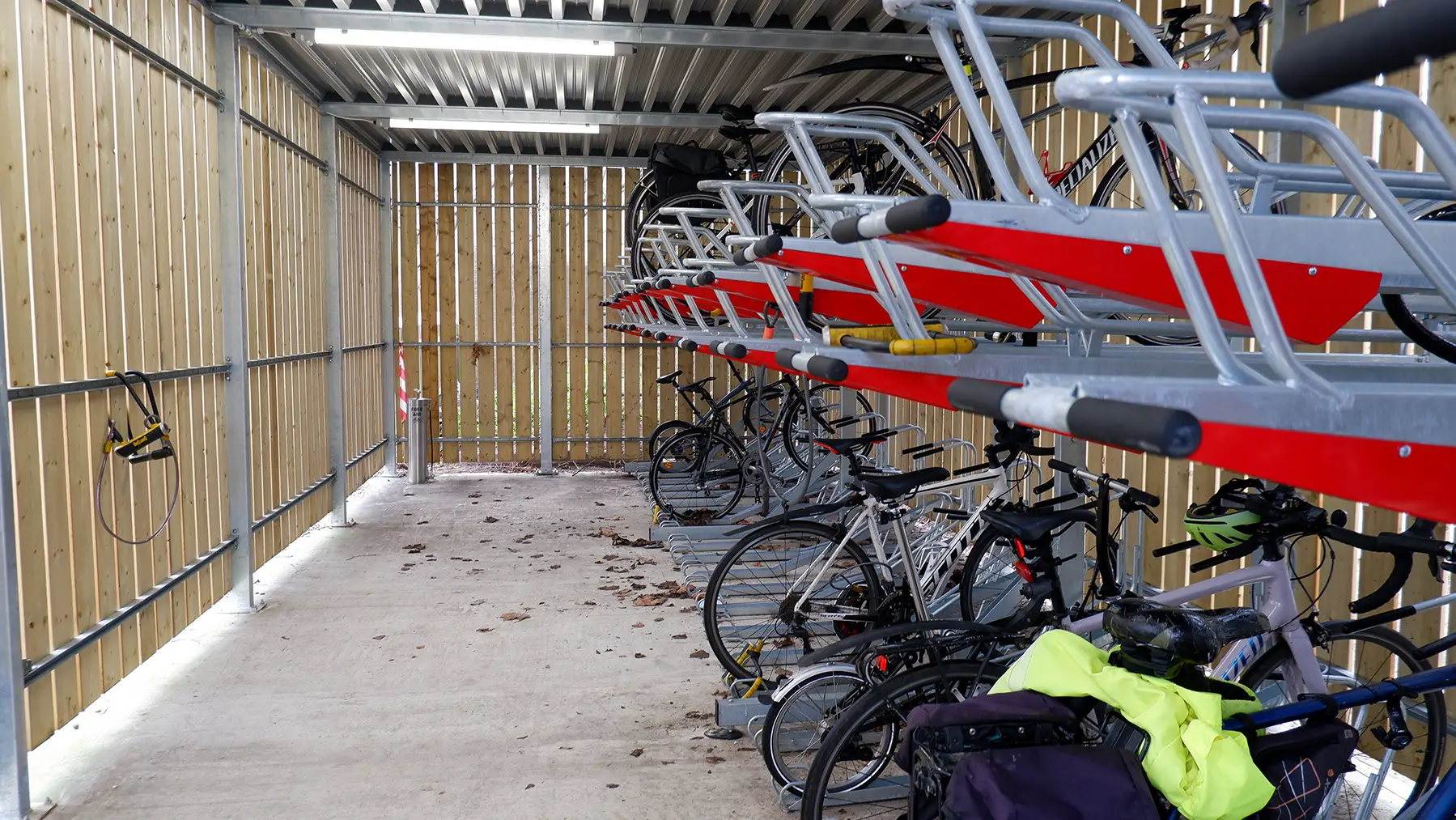 A double-decker bicycle rack filled with bicycles, offering space-saving storage for multiple bikes.