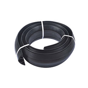 Black floor cord cover made of recycled rubber with three channels to receive one cable up to 40mm and two cables up to 20mm.